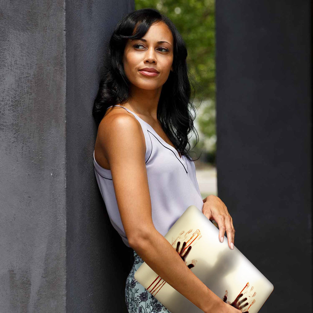 A yong girl holding personalized microsoft surface laptop case with Horror design