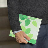 A business man holds Personalized VistaCase reMarkable Pen Holder Case with Leaves design