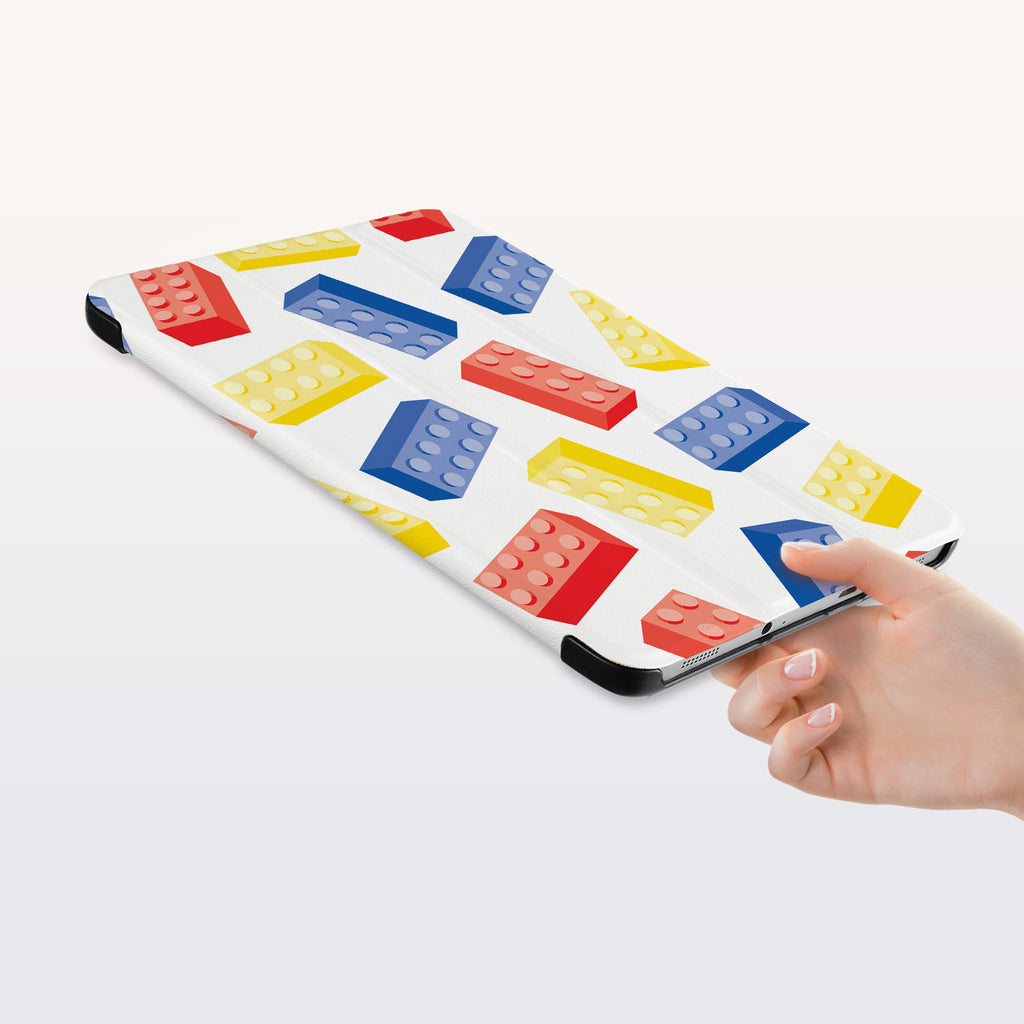 a hand is holding the Personalized Samsung Galaxy Tab Case with Retro Game design